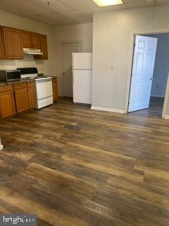 21614 Great Mills Road, Unit 104 Lexington Park, MD 20653 - Photo 6 of 17 a view of a kitchen with stainless steel appliances wooden cabinets and a counter top space