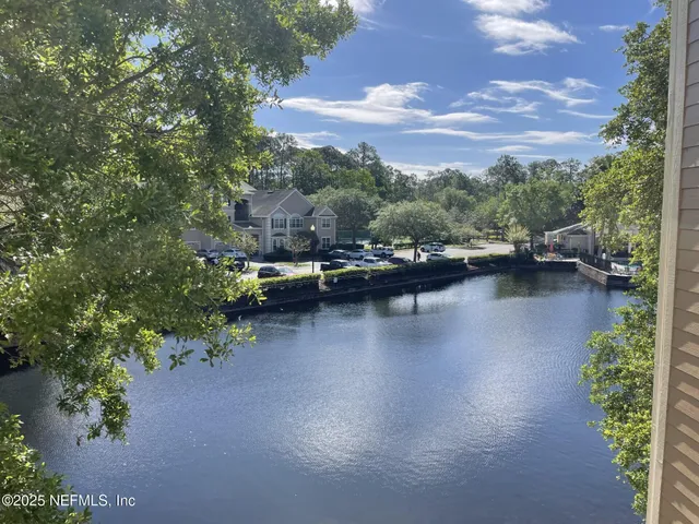 a view of a lake with boats and trees