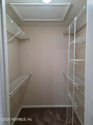 a view of an empty walk in closet