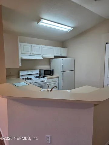 a view of kitchen cabinets
