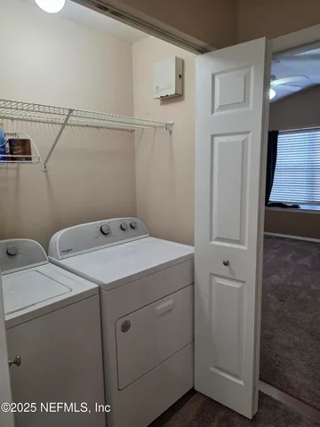 a utility room with dryer and washer
