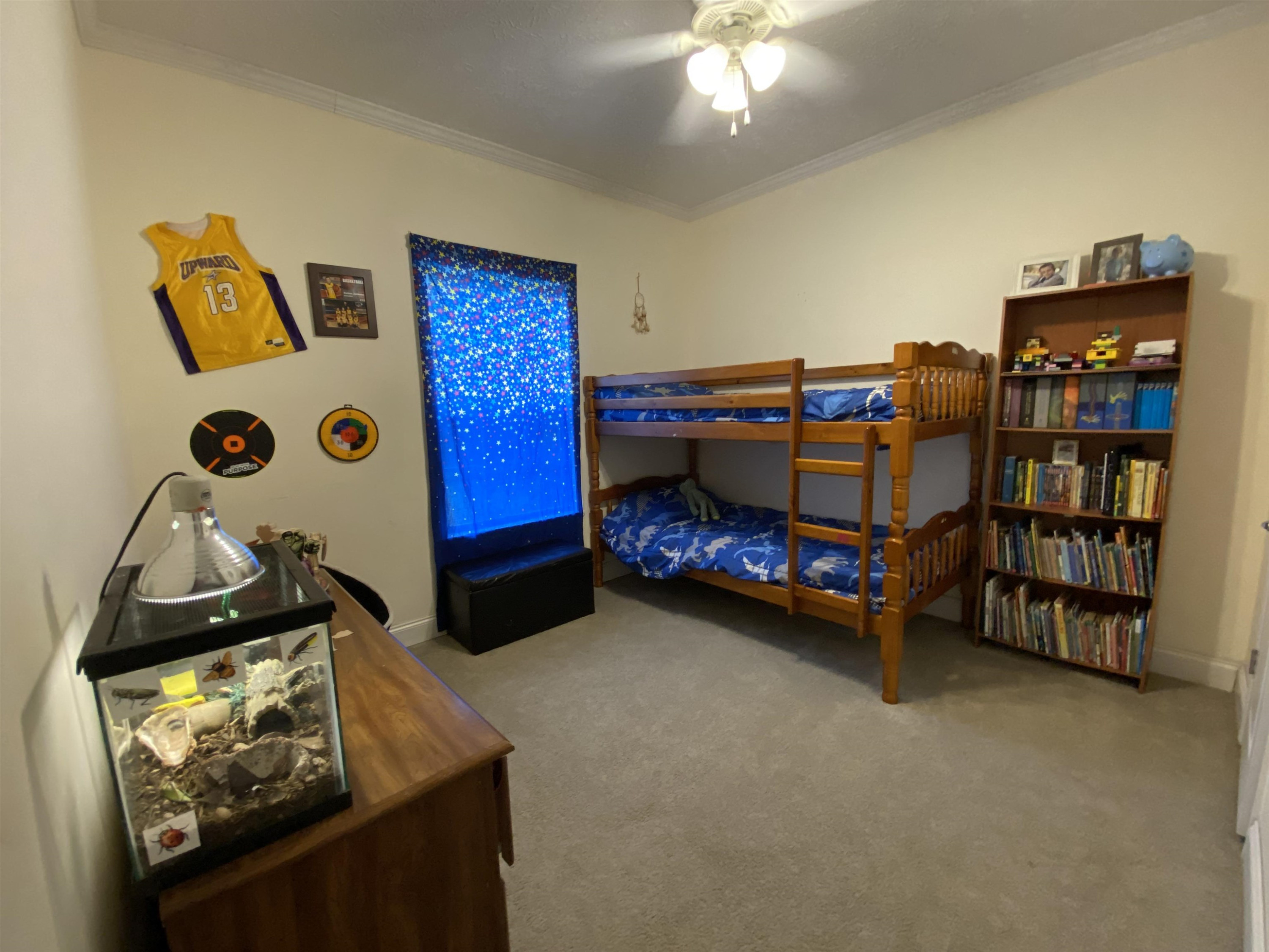 3070 Westport Road Huntingdon, TN 38344 - Photo 12 of 23 a bedroom with bed and a chandelier