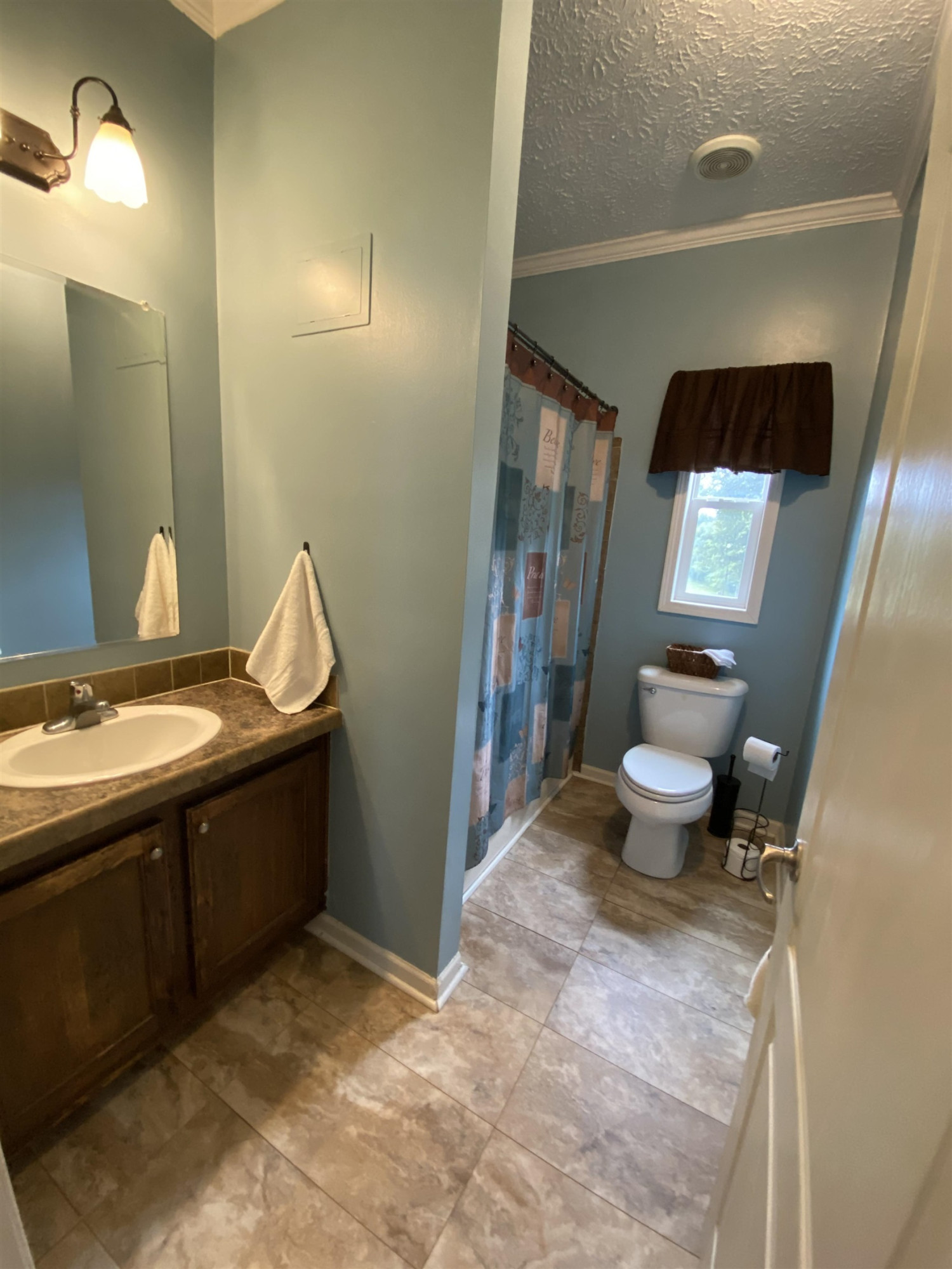 3070 Westport Road Huntingdon, TN 38344 - Photo 14 of 23 a bathroom with a sink and mirror