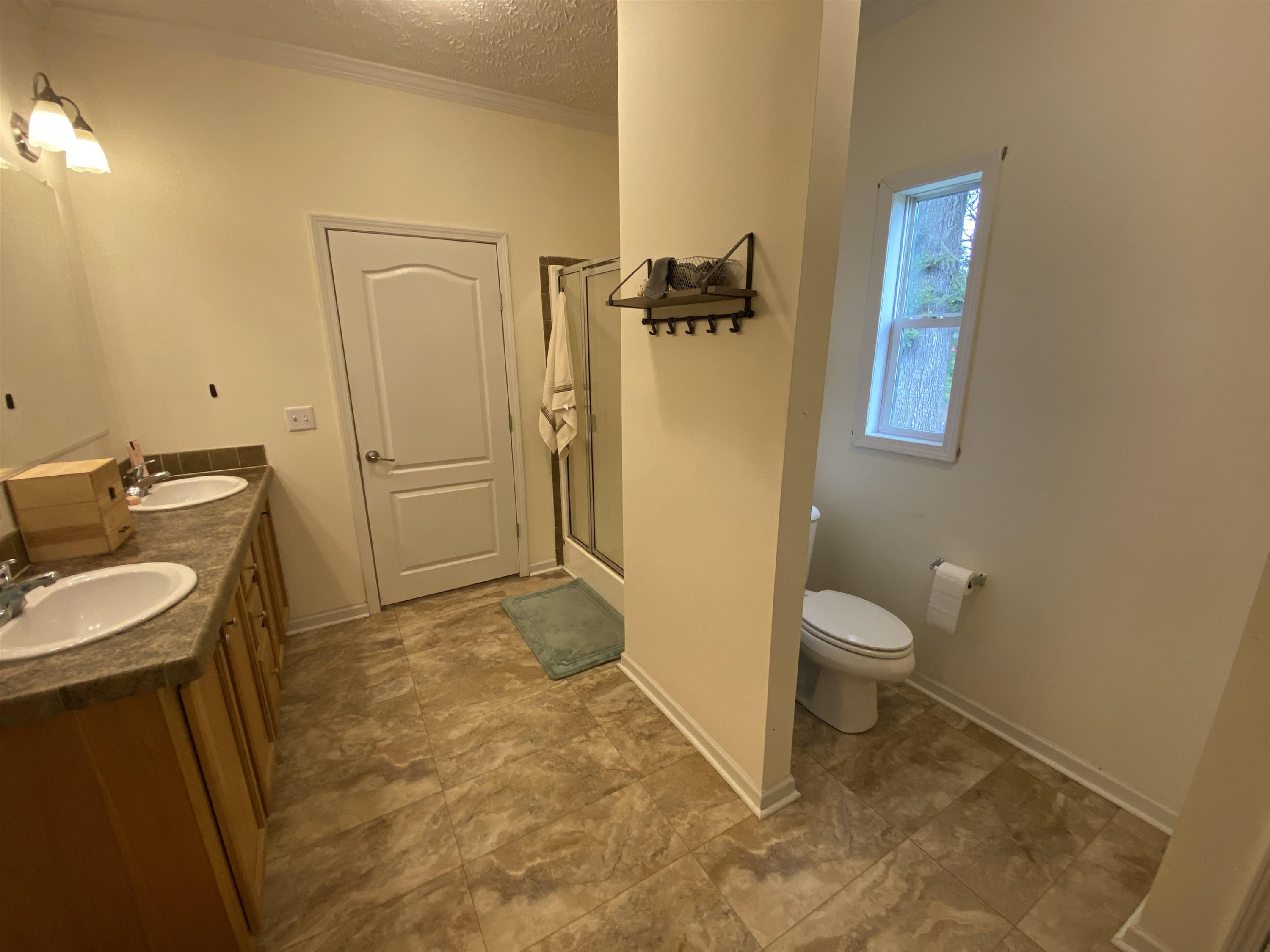 3070 Westport Road Huntingdon, TN 38344 - Photo 19 of 23 a bathroom with a sink a toilet and shower