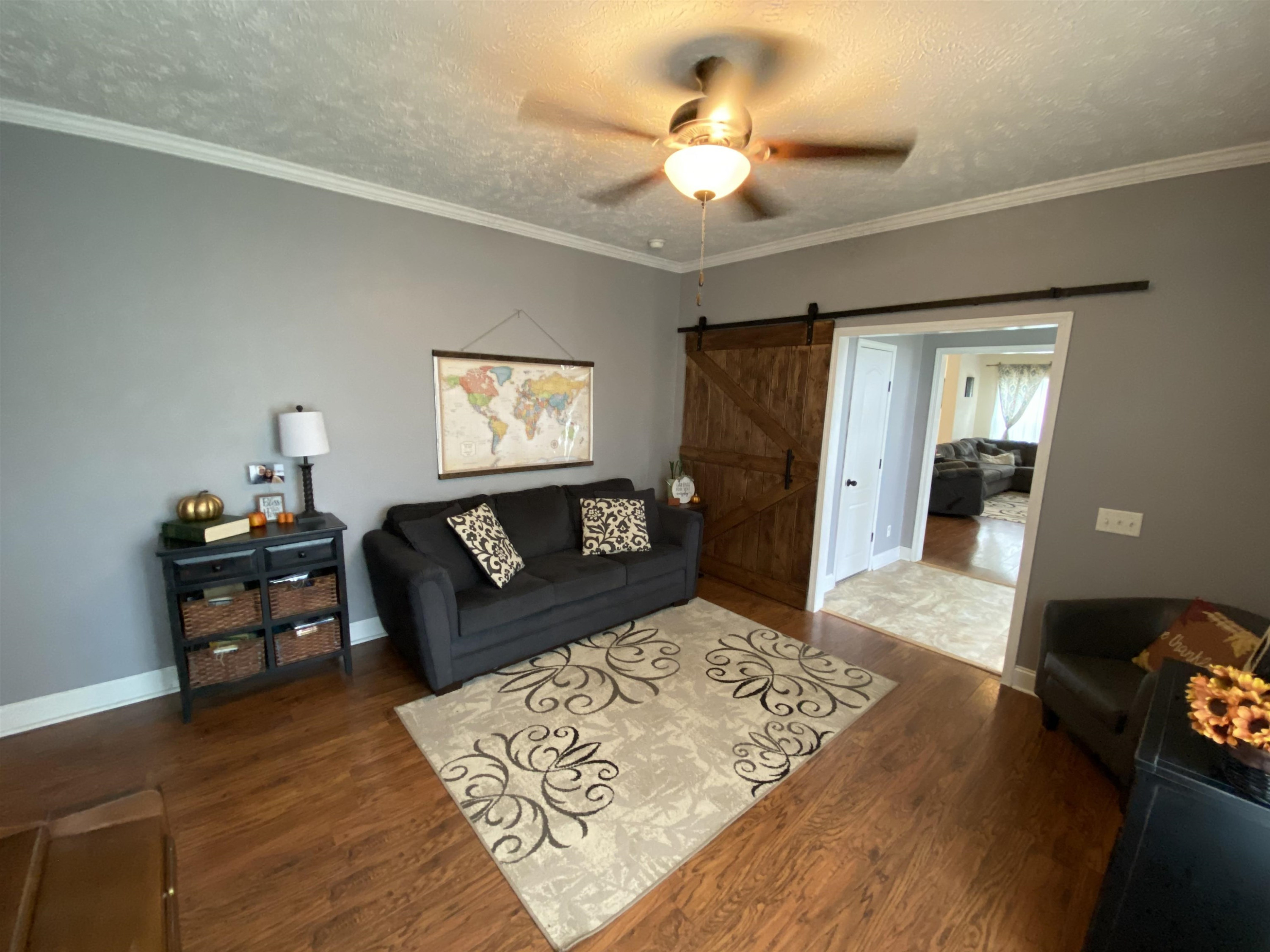 3070 Westport Road Huntingdon, TN 38344 - Photo 8 of 23 a living room with furniture and a chandelier