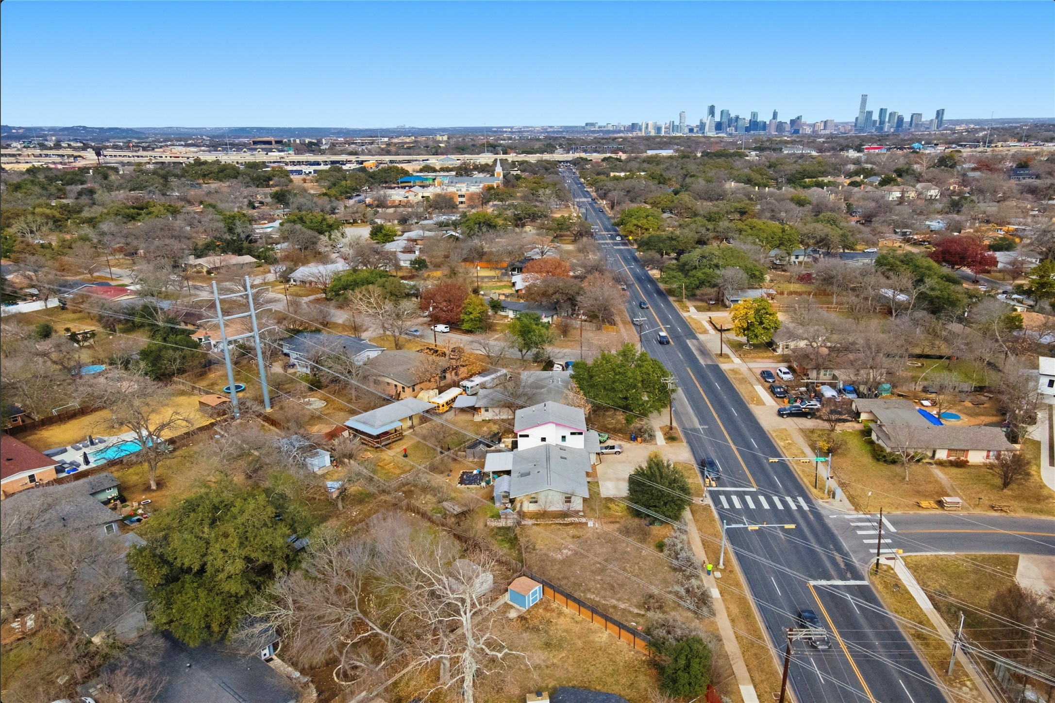 4804 Menchaca Road Austin, TX 78745 - Photo 37 of 38 Aerial overview of property's location with nearby suburban area and skyline