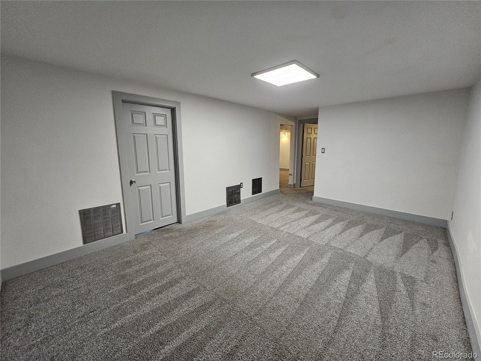 1723 Ascot Road Colorado Springs, CO 80906 - Photo 16 of 29 a view of empty room with wooden floor