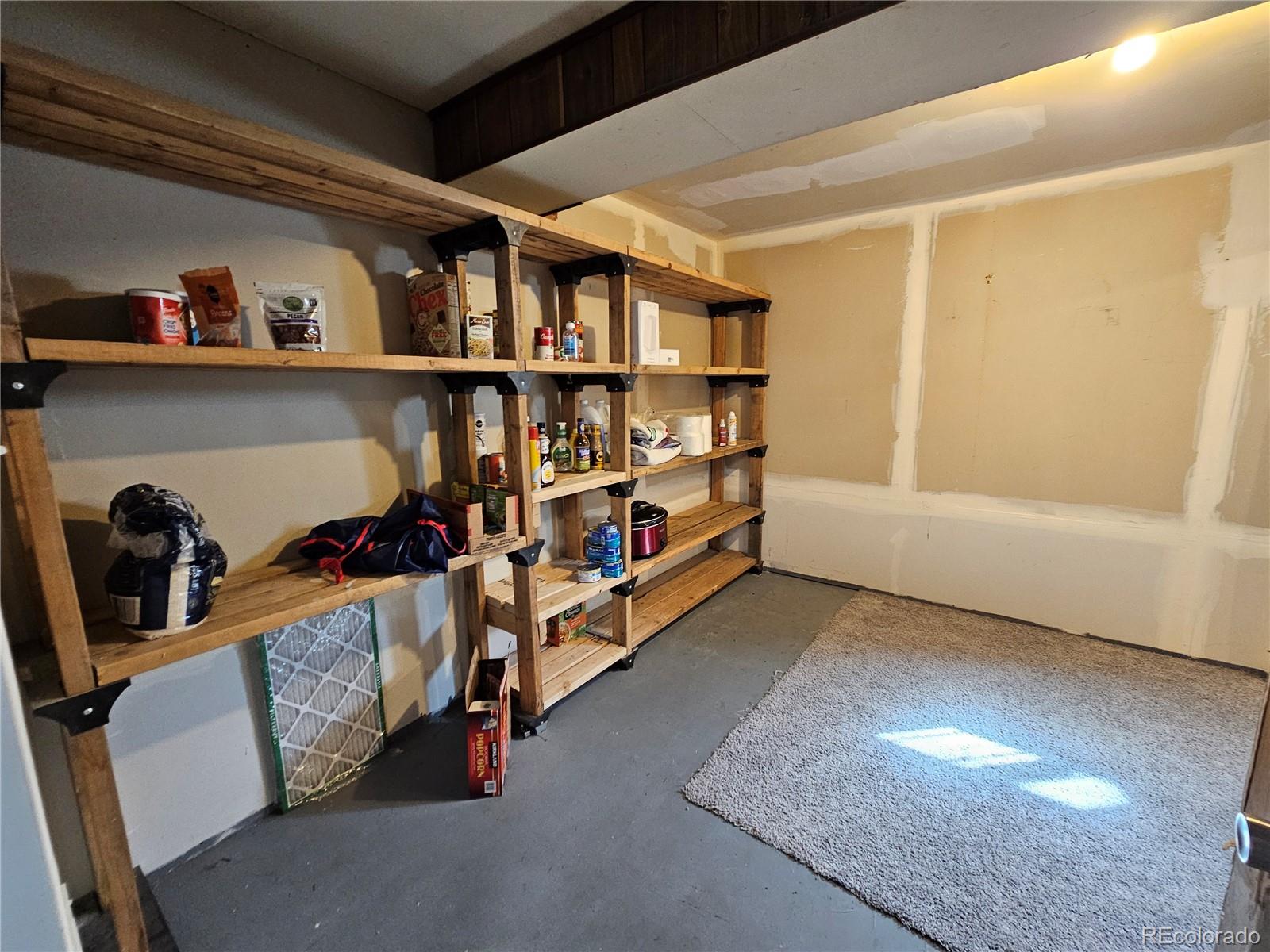 1723 Ascot Road Colorado Springs, CO 80906 - Photo 17 of 29 a view of livingroom with furniture and toys