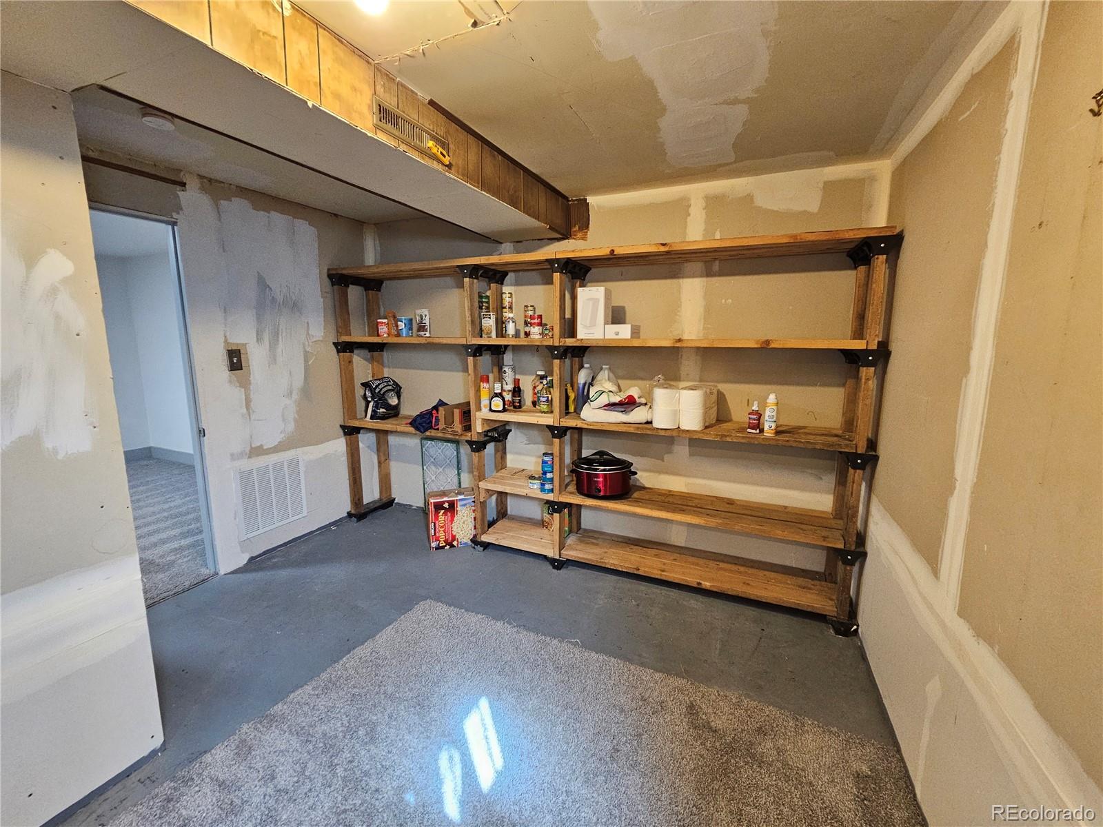 1723 Ascot Road Colorado Springs, CO 80906 - Photo 18 of 29 a view of store room with racks