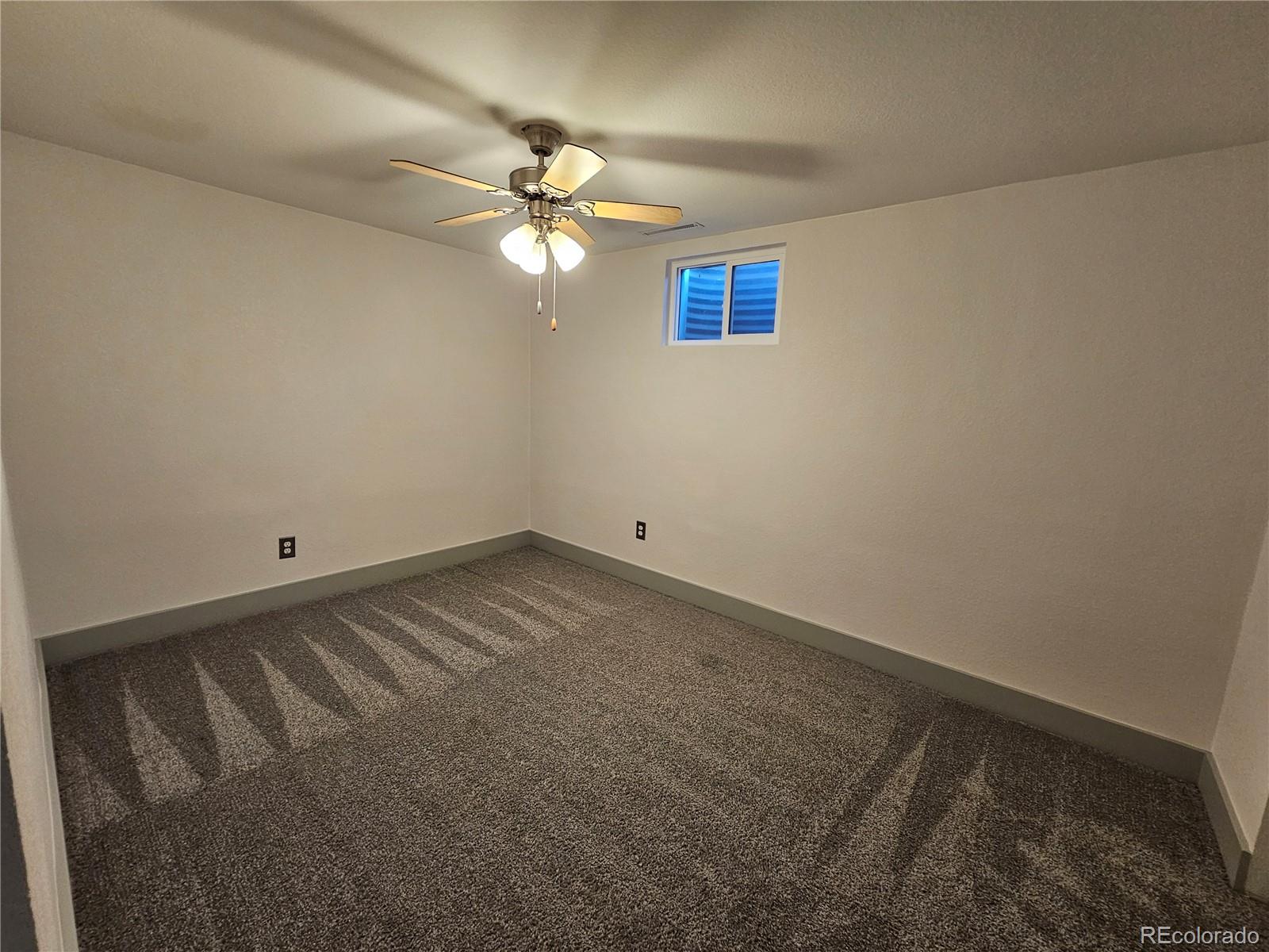 1723 Ascot Road Colorado Springs, CO 80906 - Photo 23 of 29 a view of a big room with carpet
