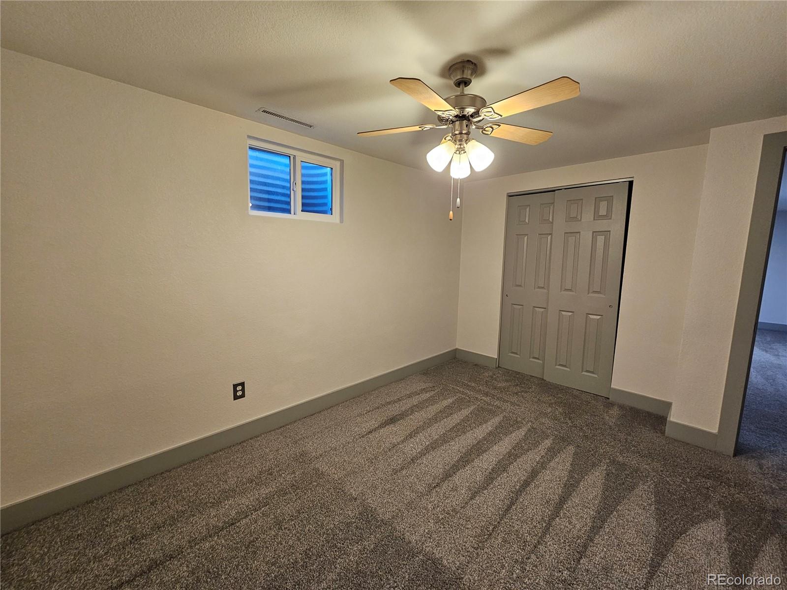 1723 Ascot Road Colorado Springs, CO 80906 - Photo 24 of 29 a view of an empty room with a window