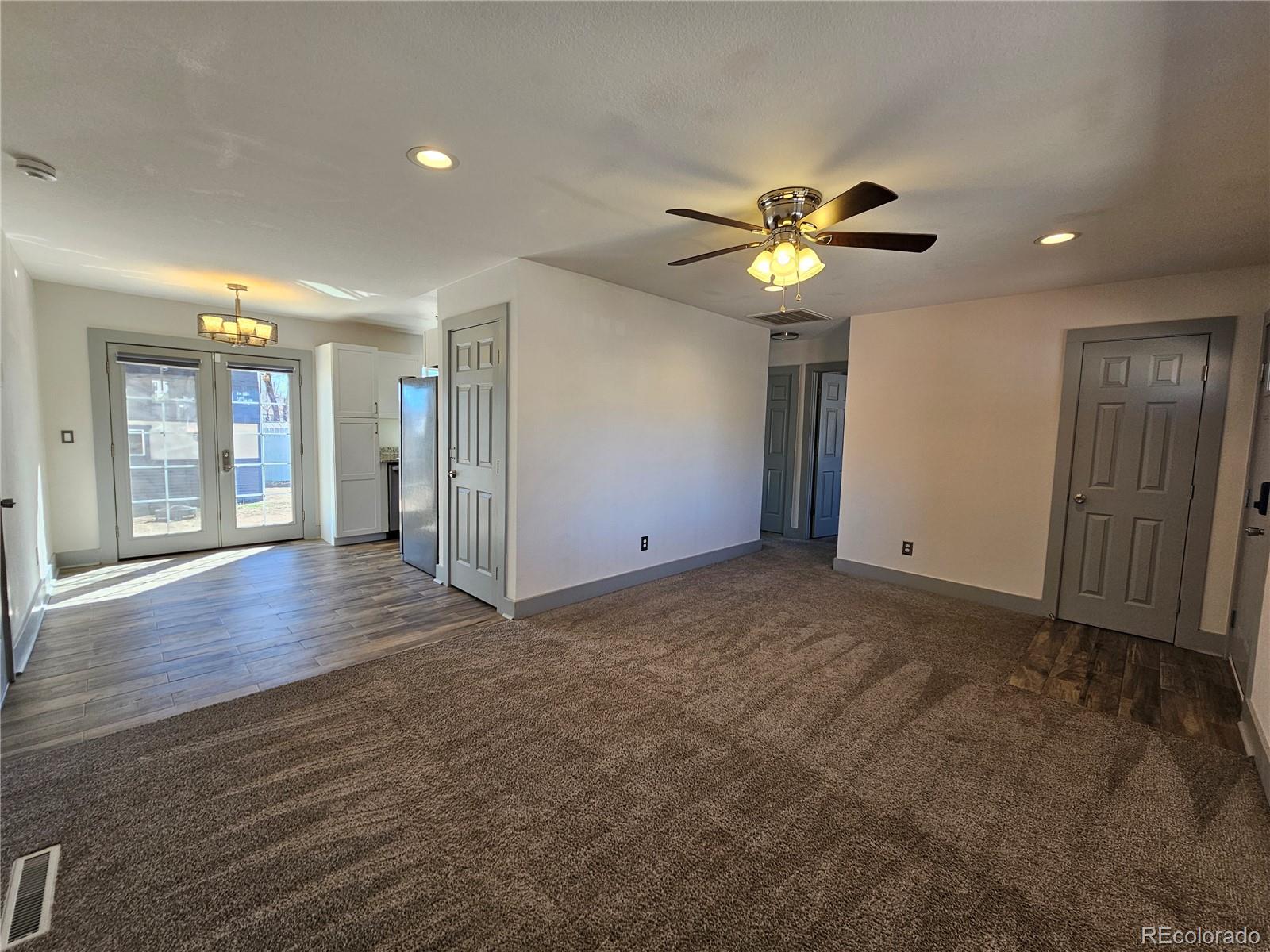 1723 Ascot Road Colorado Springs, CO 80906 - Photo 4 of 29 a view of empty room with wooden floor