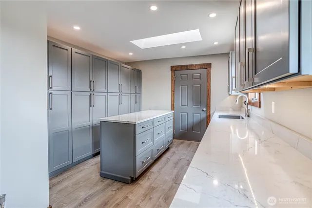 a bathroom with a double vanity sink and mirror