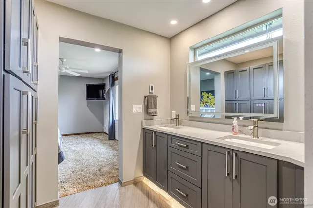 a bathroom with a sink and a mirror