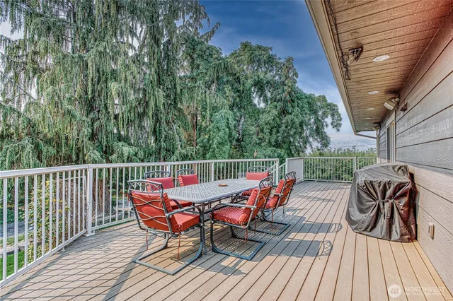 a view of a chairs on the roof deck