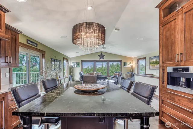 a view of a dining room with furniture window and outside view