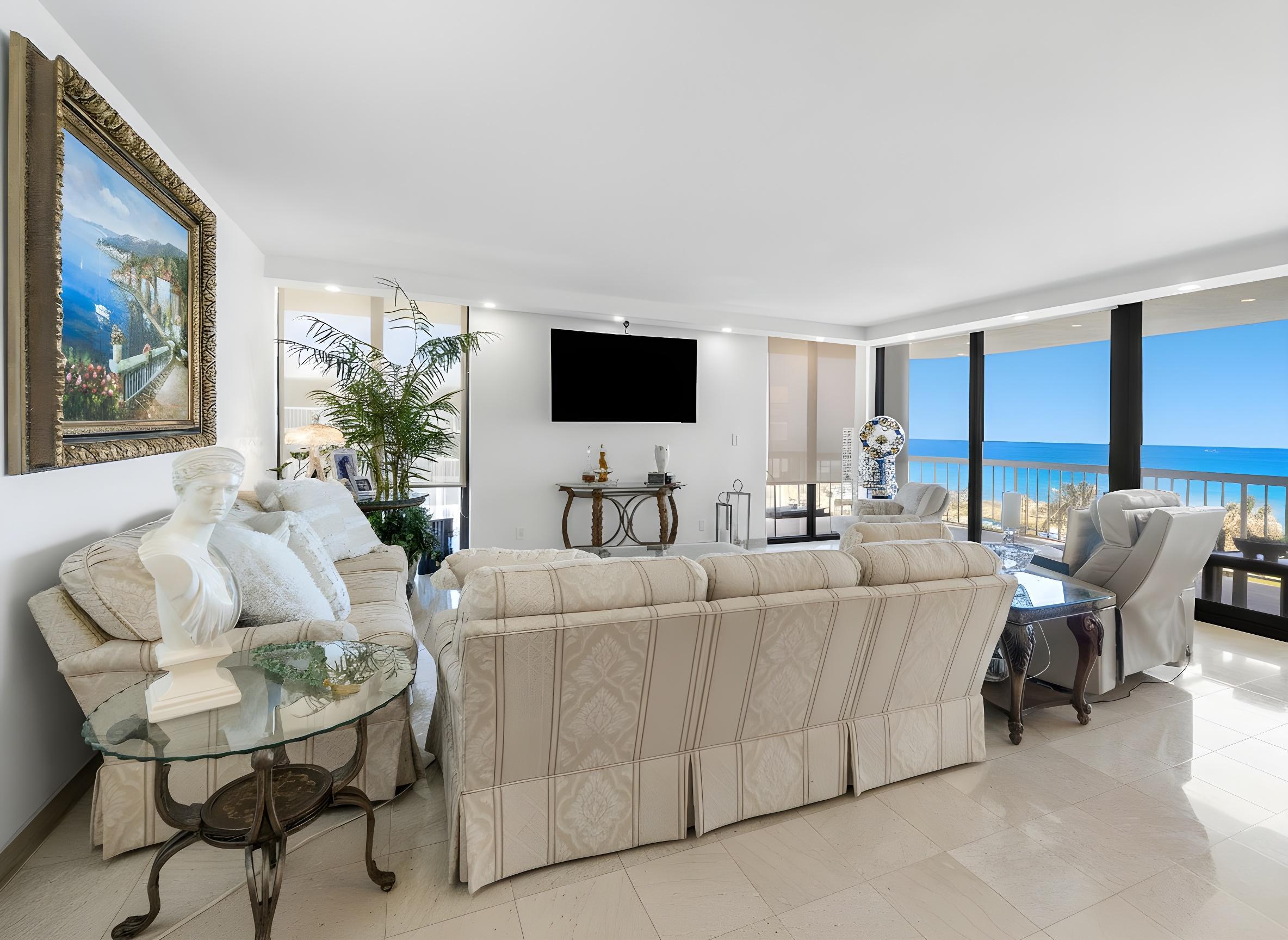 3300 South Ocean Boulevard, Unit 405 Palm Beach, FL 33480 - Photo 11 of 23 a living room with furniture and a flat screen tv