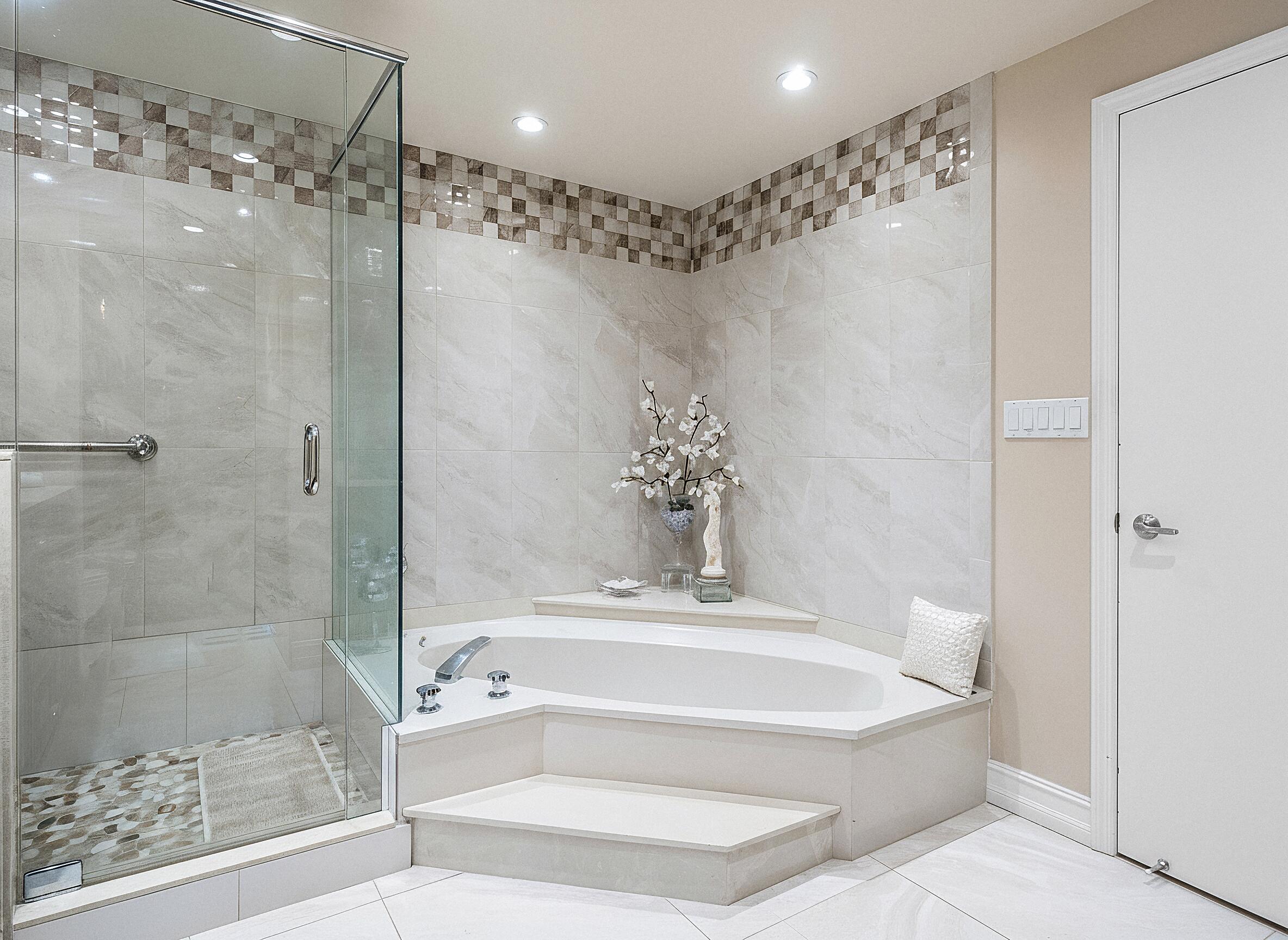 3300 South Ocean Boulevard, Unit 405 Palm Beach, FL 33480 - Photo 15 of 23 a bathroom with a bathtub and a shower