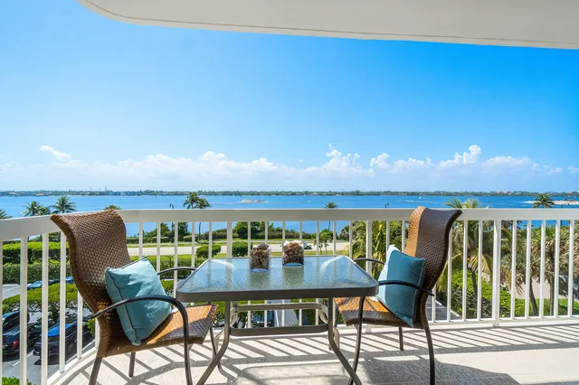 a view of a chairs and table in patio