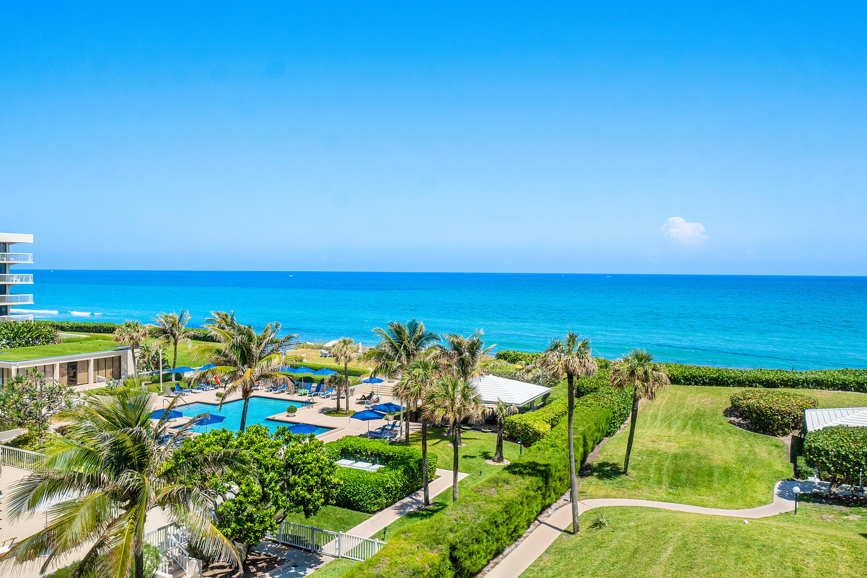 3300 South Ocean Boulevard, Unit 405 Palm Beach, FL 33480 - Photo 4 of 23 a view of a lake with a building in the background