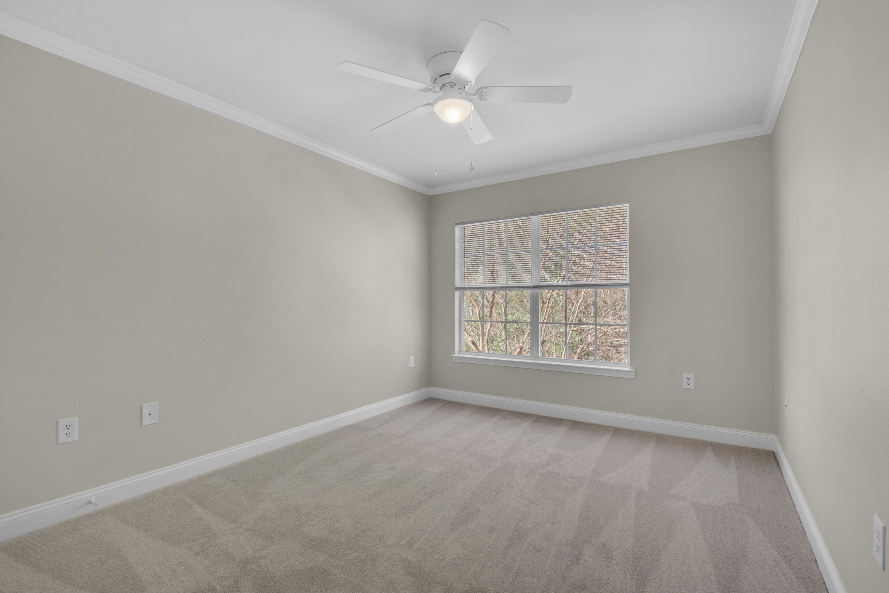 537 Wingspan Way Crestview, FL 32536 - Photo 16 of 34 an empty room with a window and a ceiling fan