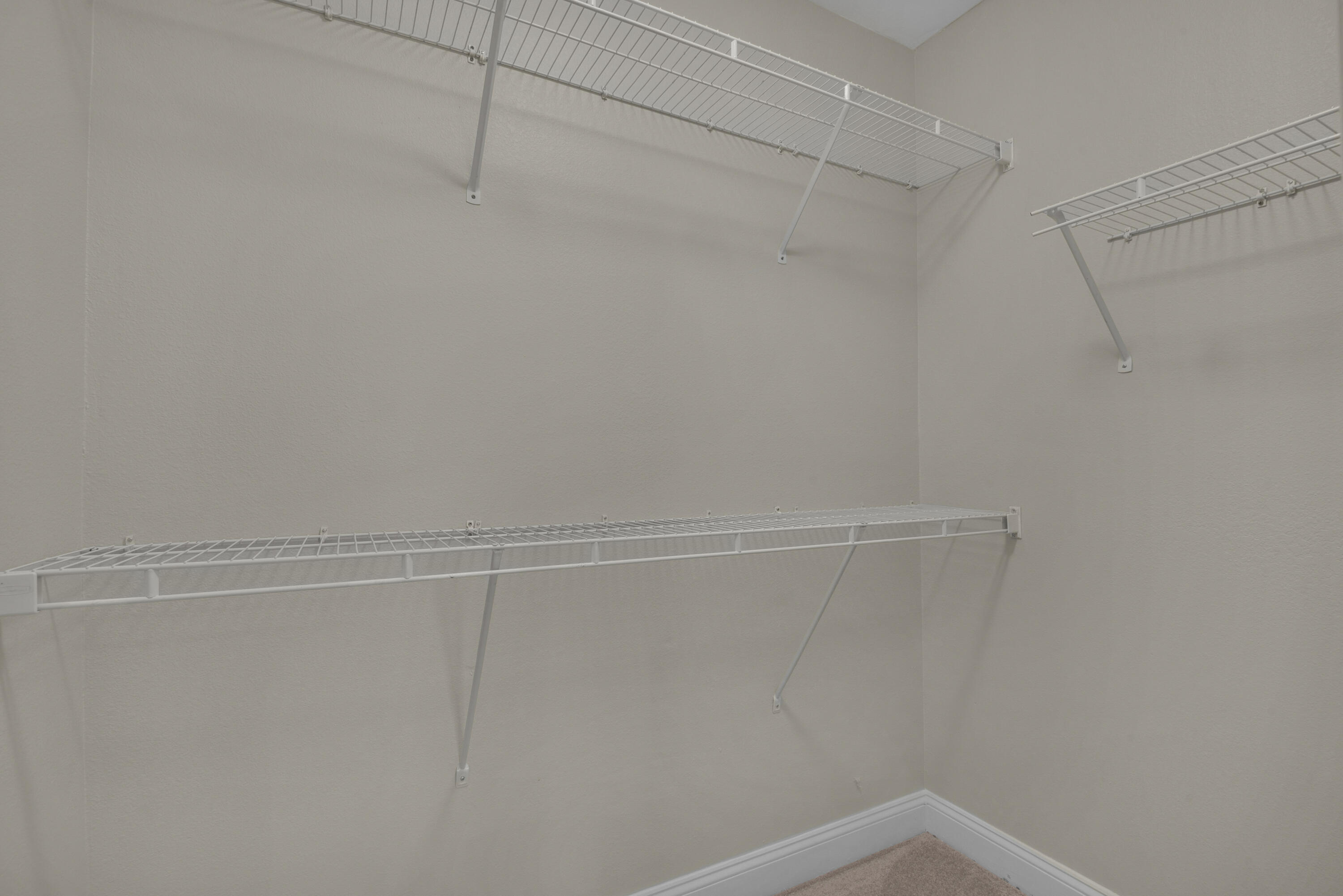 537 Wingspan Way Crestview, FL 32536 - Photo 17 of 34 a view of a room with racks on the wall