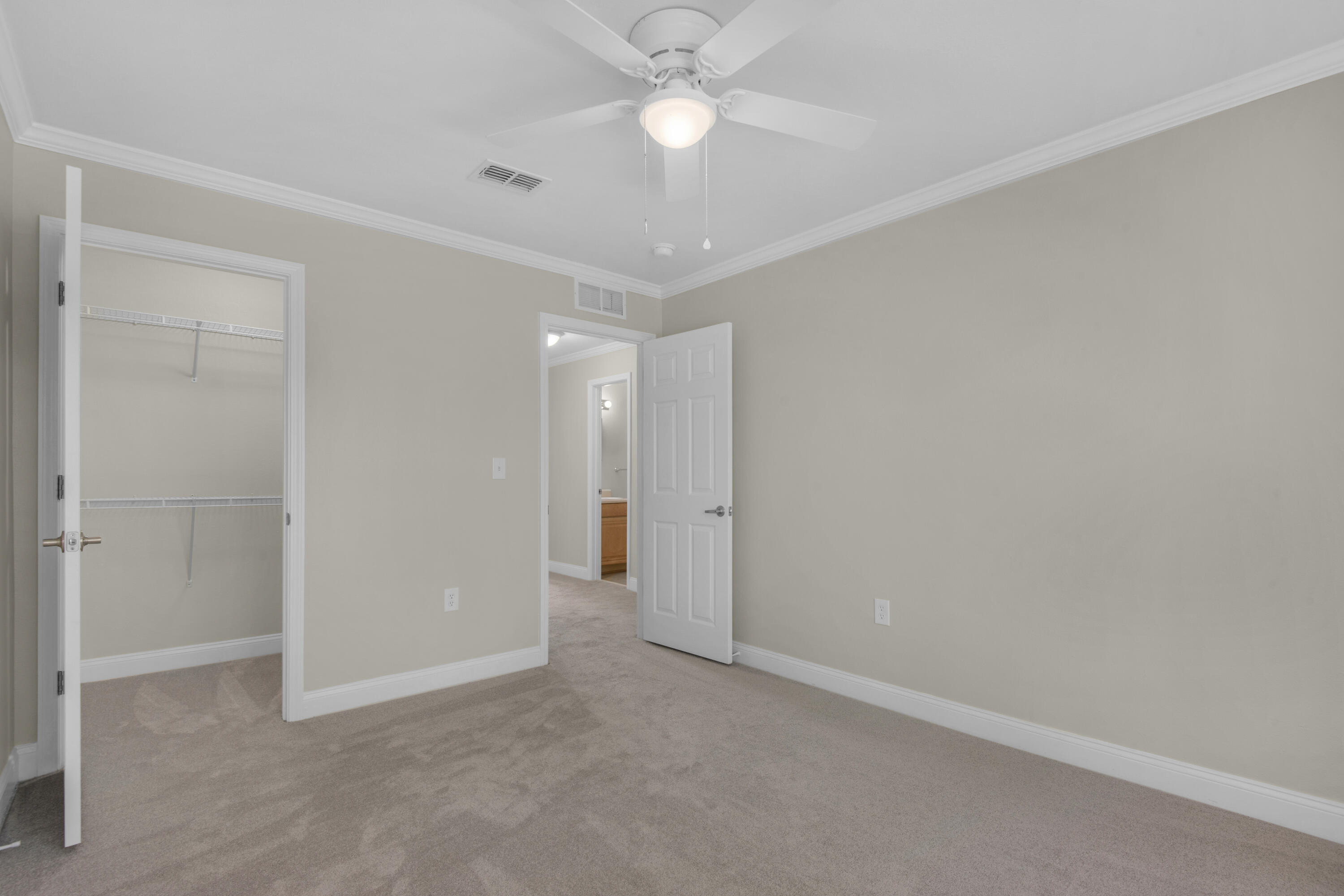 537 Wingspan Way Crestview, FL 32536 - Photo 19 of 34 an empty room with closet and a ceiling fan