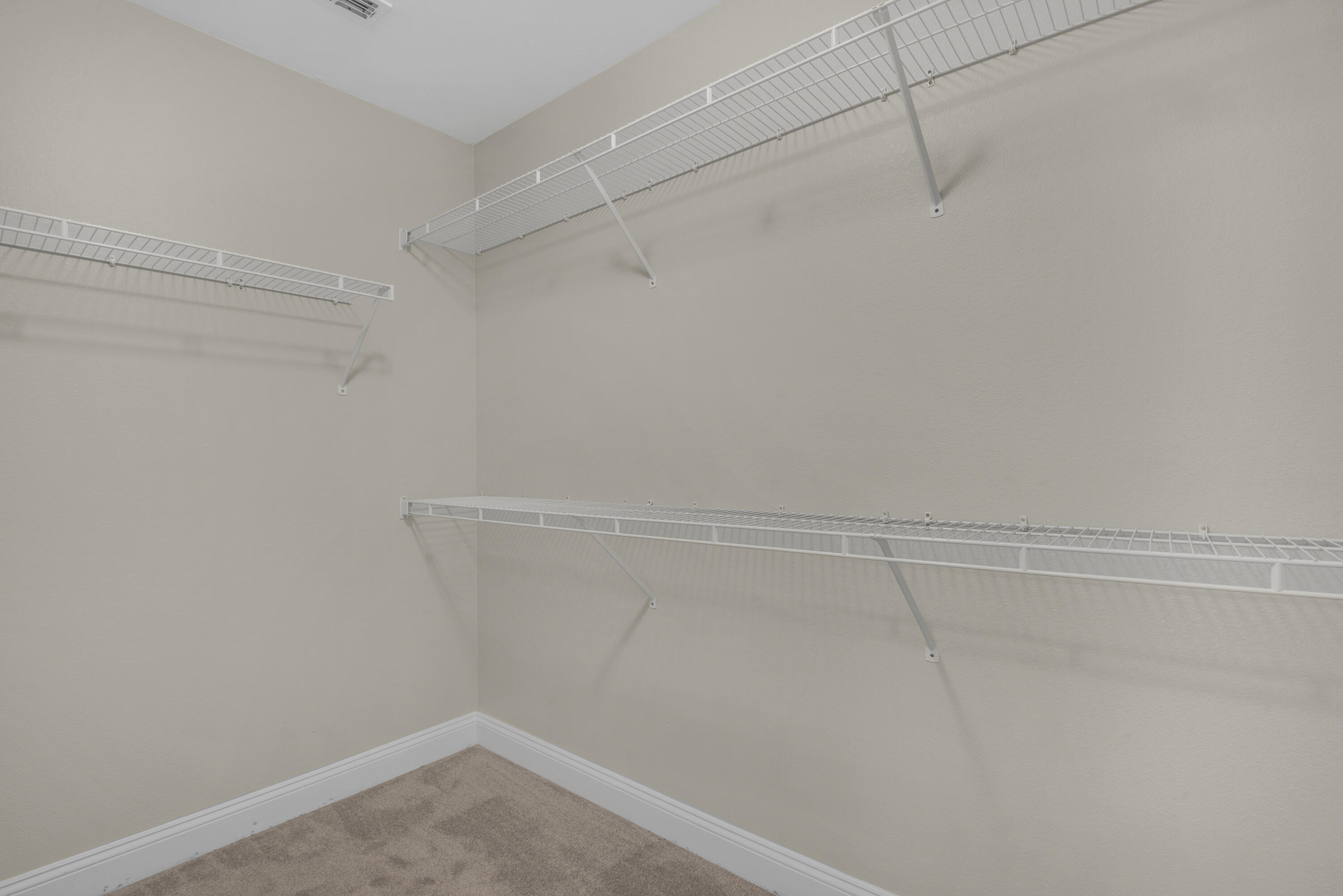 537 Wingspan Way Crestview, FL 32536 - Photo 21 of 34 a view of a room with racks on the wall