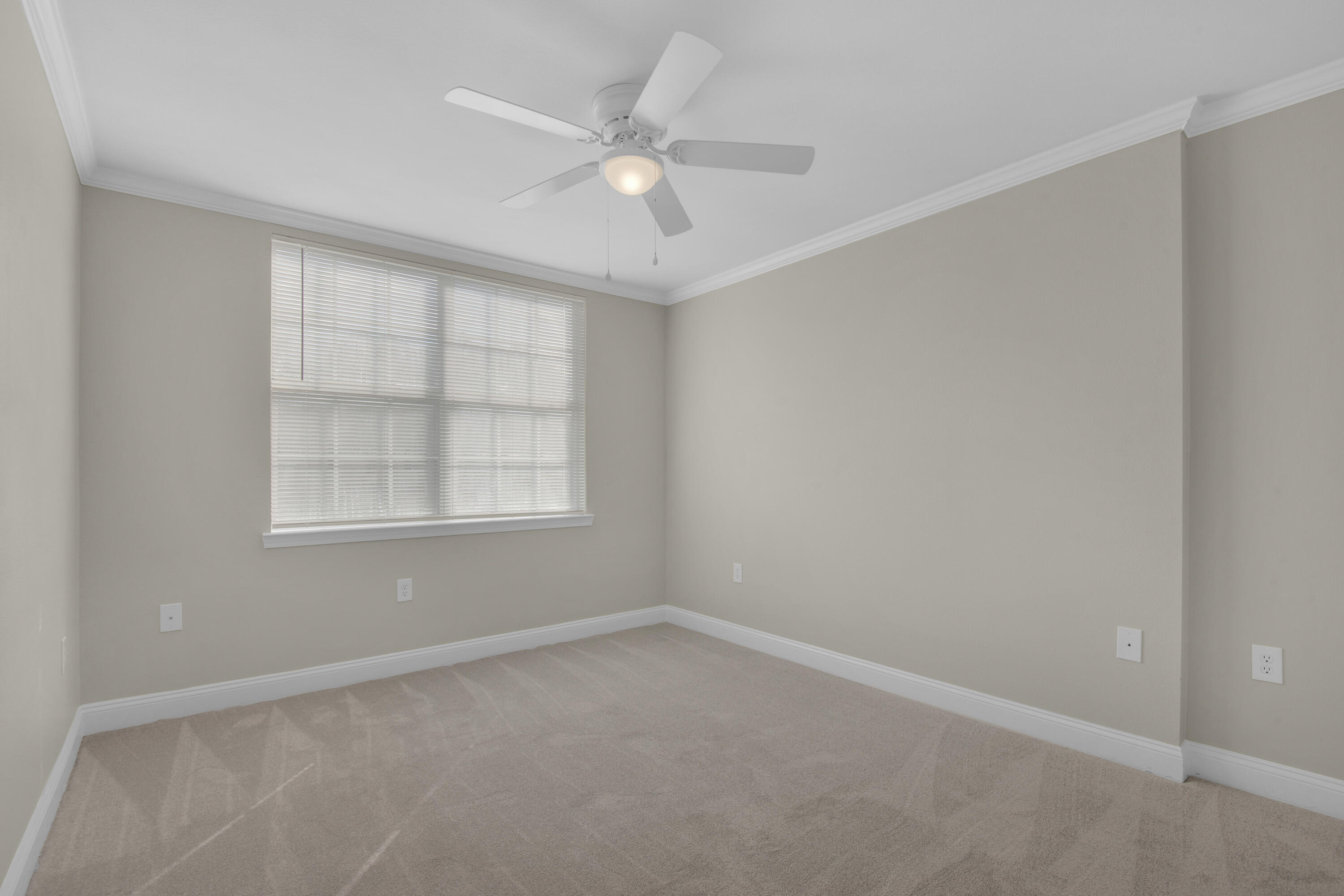 537 Wingspan Way Crestview, FL 32536 - Photo 25 of 34 an empty room with a window and a fan