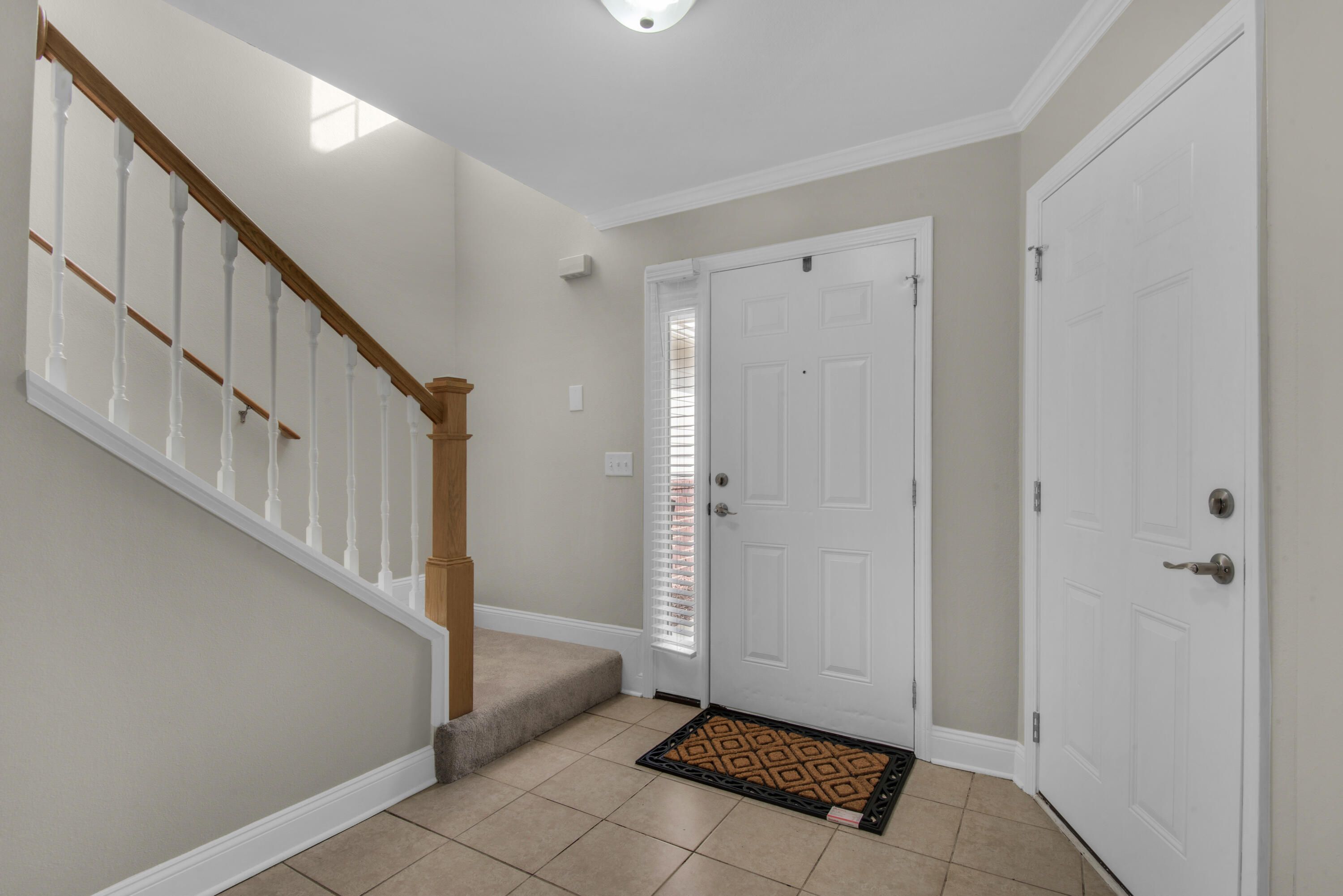 537 Wingspan Way Crestview, FL 32536 - Photo 3 of 34 a view of entryway with stairs and a window