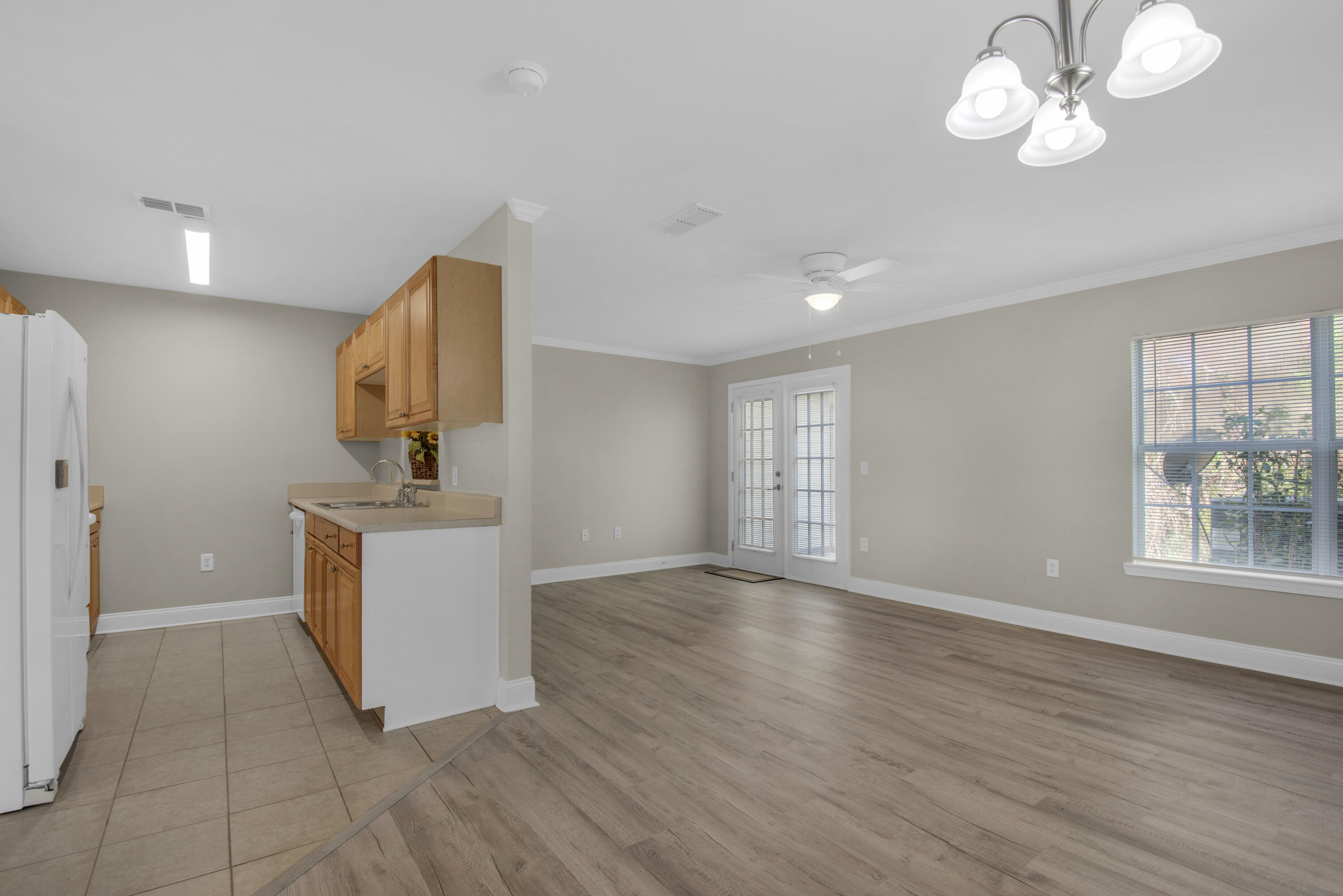 537 Wingspan Way Crestview, FL 32536 - Photo 6 of 34 a view of room with window and wooden floor
