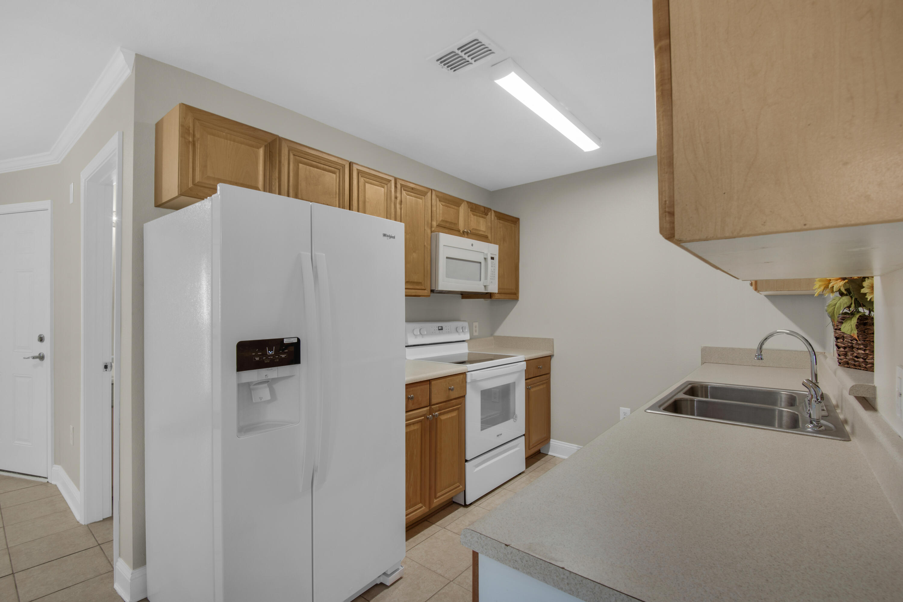 537 Wingspan Way Crestview, FL 32536 - Photo 7 of 34 a white refrigerator freezer sitting inside of a kitchen