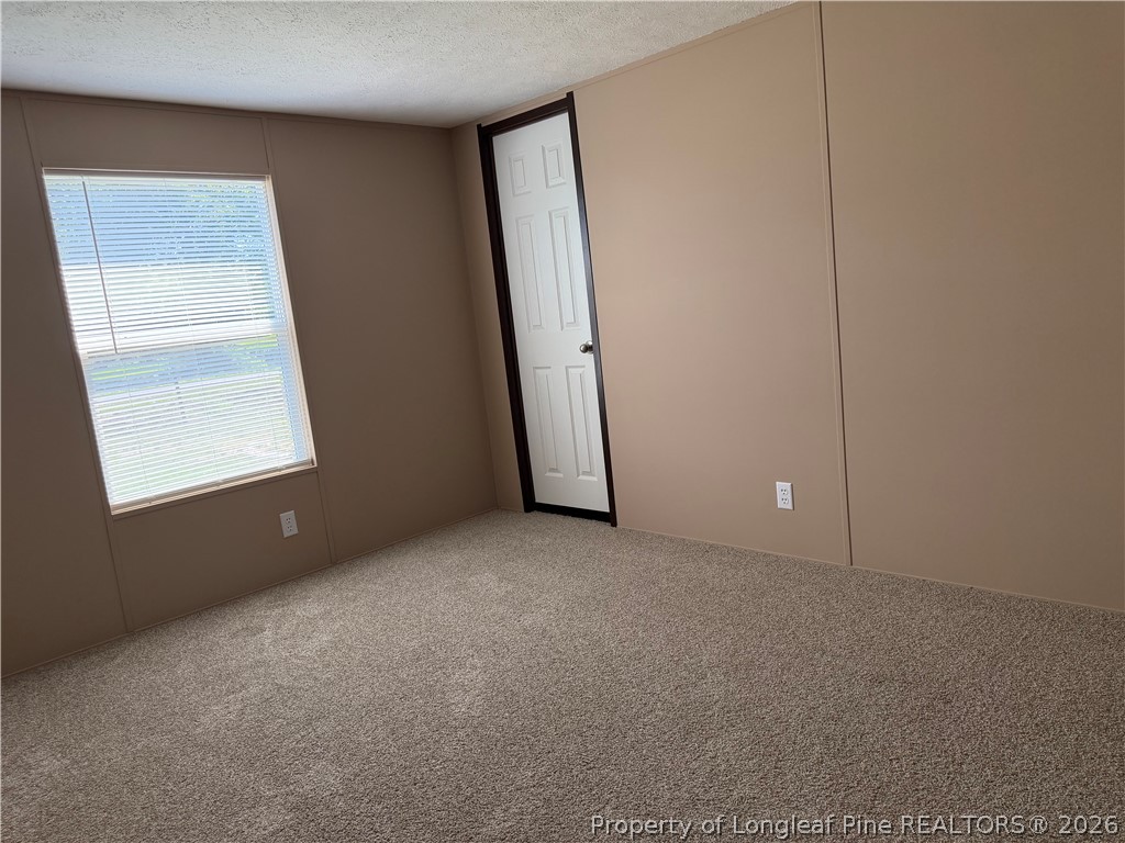 4339 Saddletree Road Lumberton, NC 28360 - Photo 21 of 23 an empty room with windows and closet