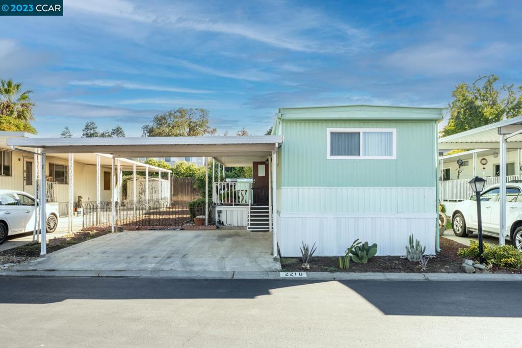 a front view of a house with a sitting area