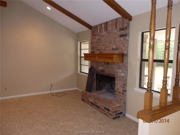 a living room with a fireplace
