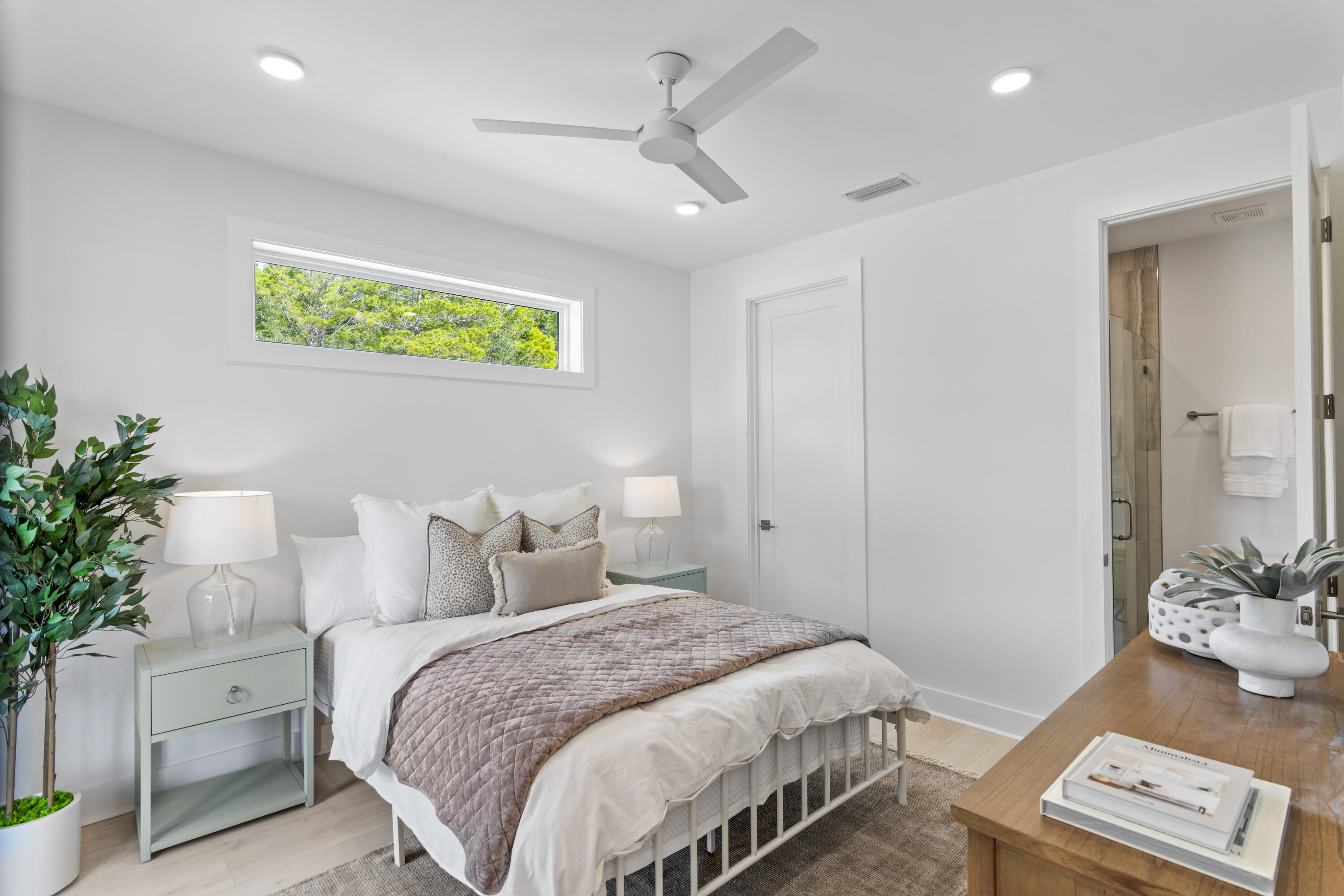 58 Sarah St Inlet Beach, Unit LOT 25 Inlet Beach, FL 32461 - Photo 12 of 31 a bedroom with a bed and a potted plant