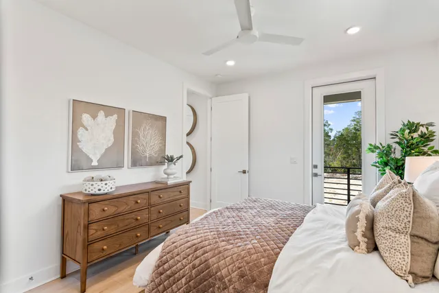 a bedroom with a bed and a dresser in it