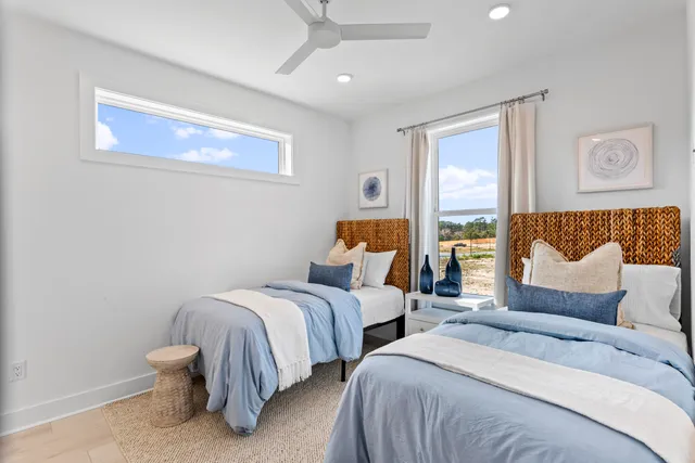 a bedroom with two beds and a couch