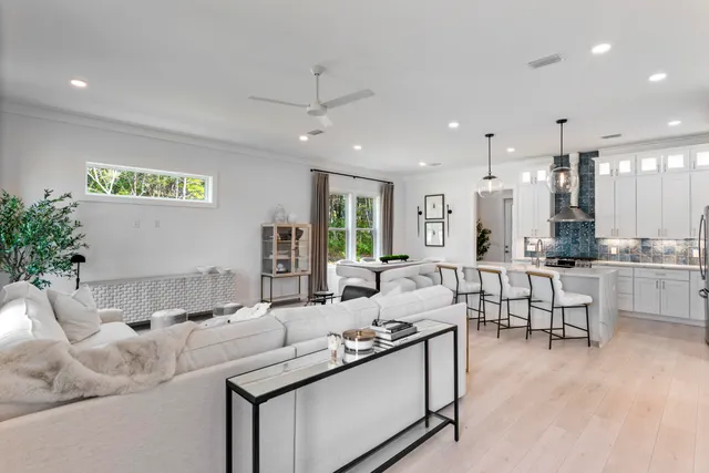 a kitchen with stainless steel appliances granite countertop a sink stove and cabinets