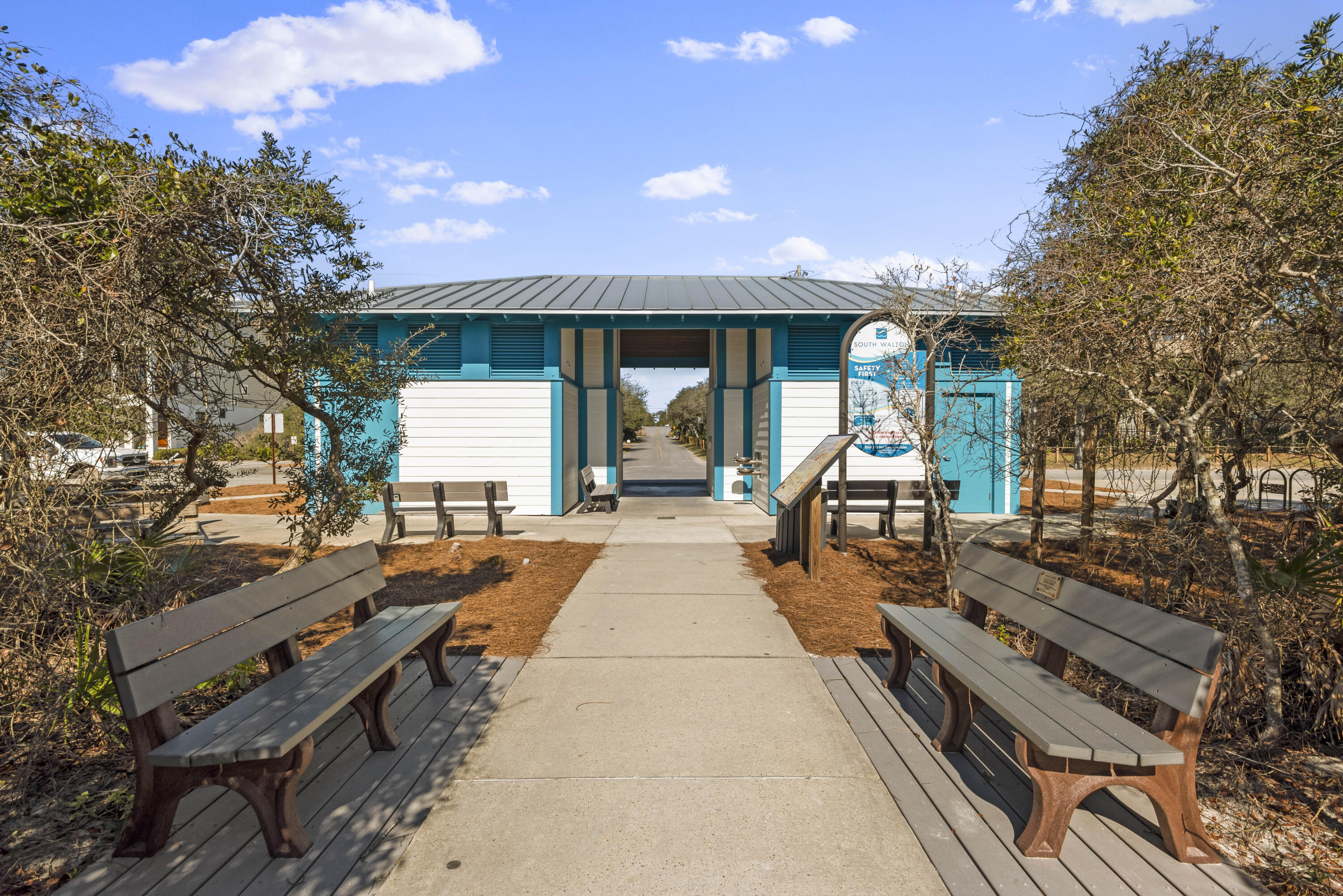 58 Sarah St Inlet Beach, Unit LOT 25 Inlet Beach, FL 32461 - Photo 28 of 31 a view of a patio with dining table and chairs with wooden floor and fence