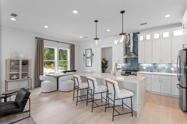 a large kitchen with granite countertop lots of counter top space