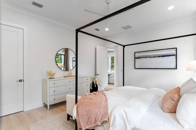 a bedroom with a bed and a dresser