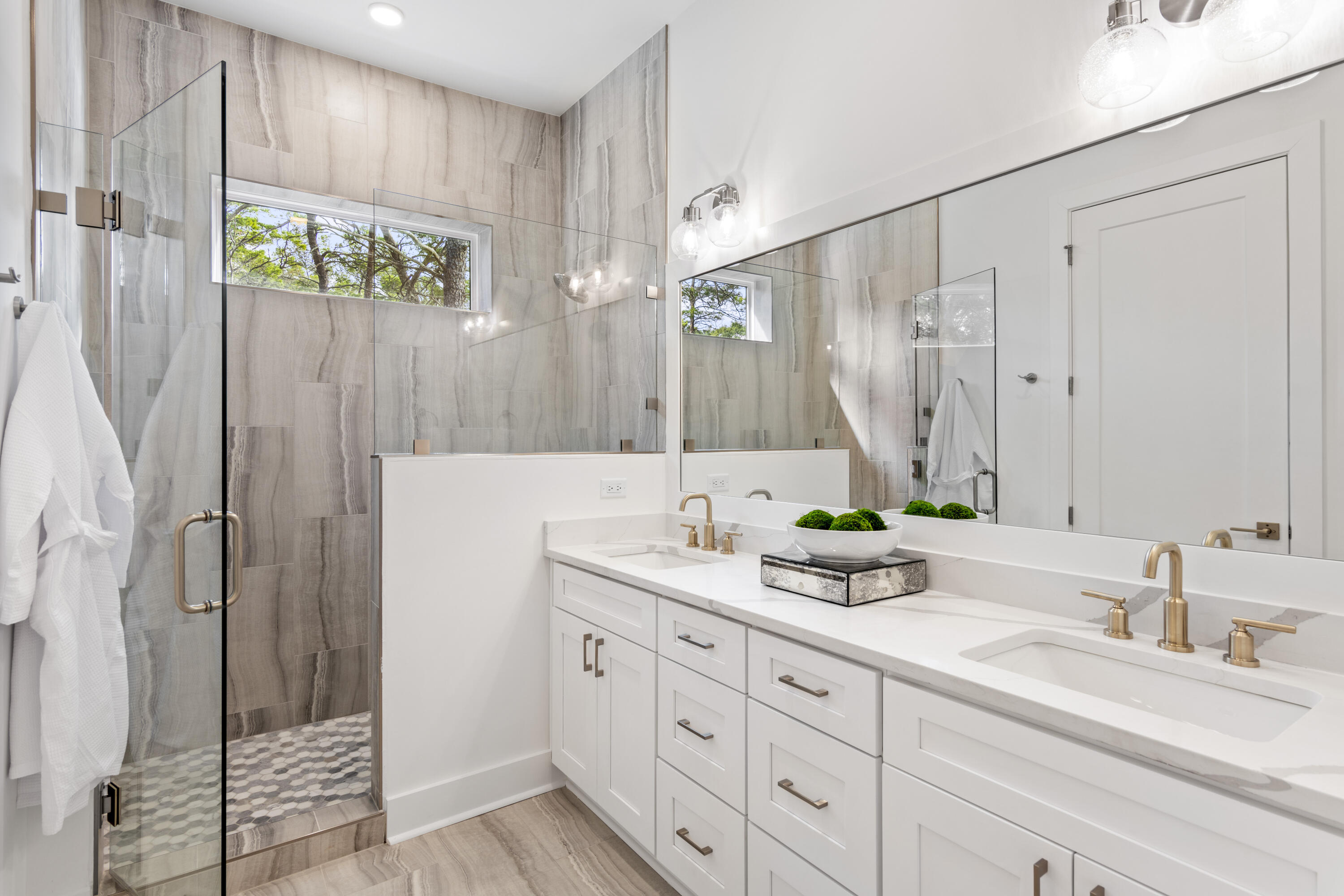 58 Sarah St Inlet Beach, Unit LOT 25 Inlet Beach, FL 32461 - Photo 8 of 31 a bathroom with a double vanity sink and a mirror