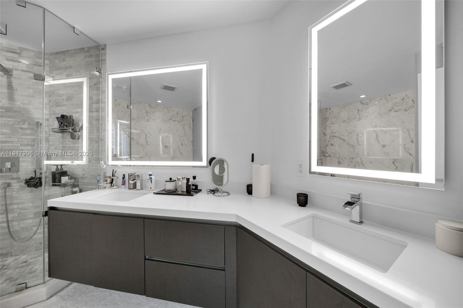 851 Northeast 1st Avenue, Unit 2203 Miami, FL 33132 - Photo 17 of 53 a bathroom with a double vanity sink mirror and double