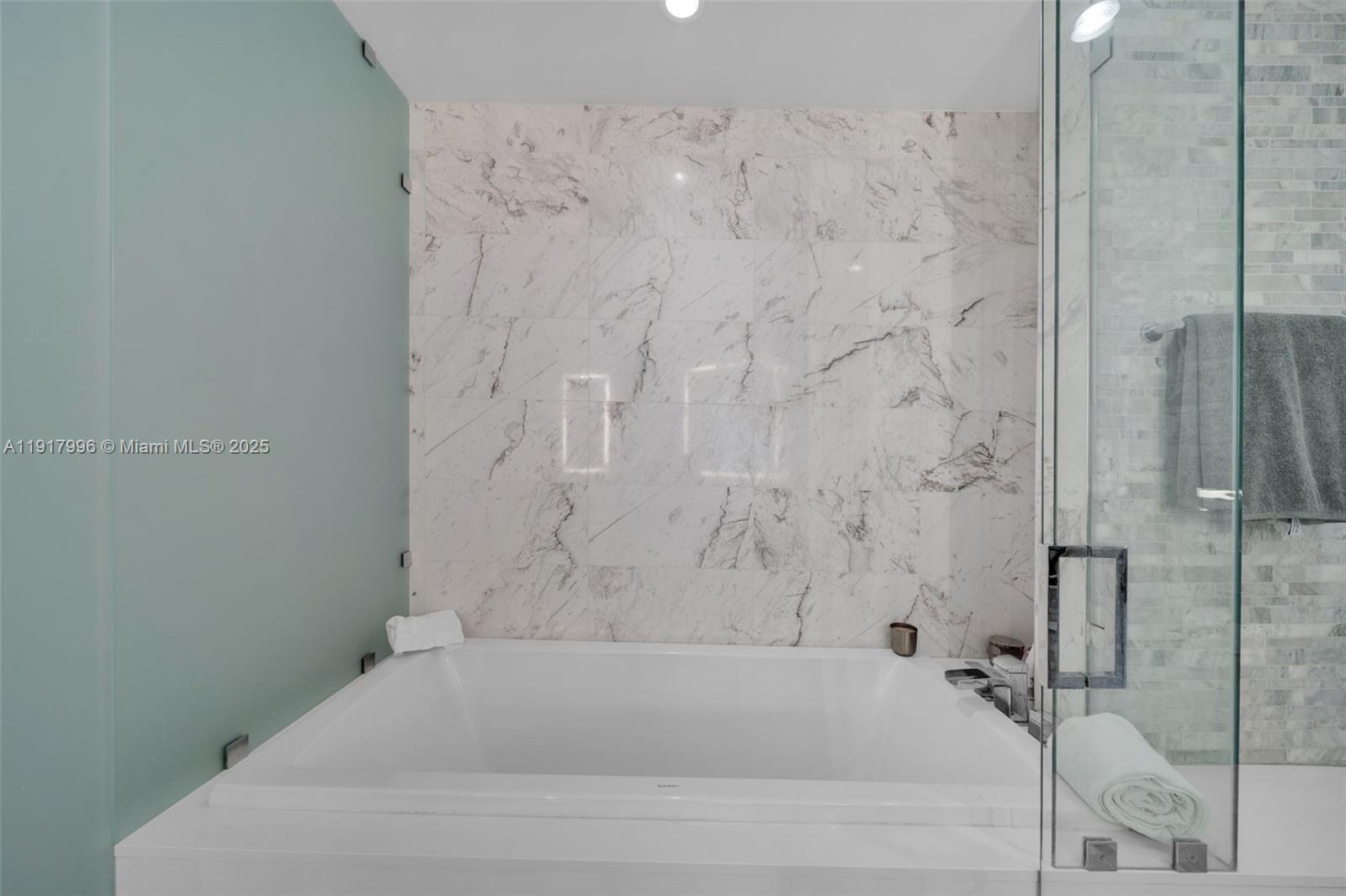 851 Northeast 1st Avenue, Unit 2203 Miami, FL 33132 - Photo 19 of 53 a bathroom with a bathtub