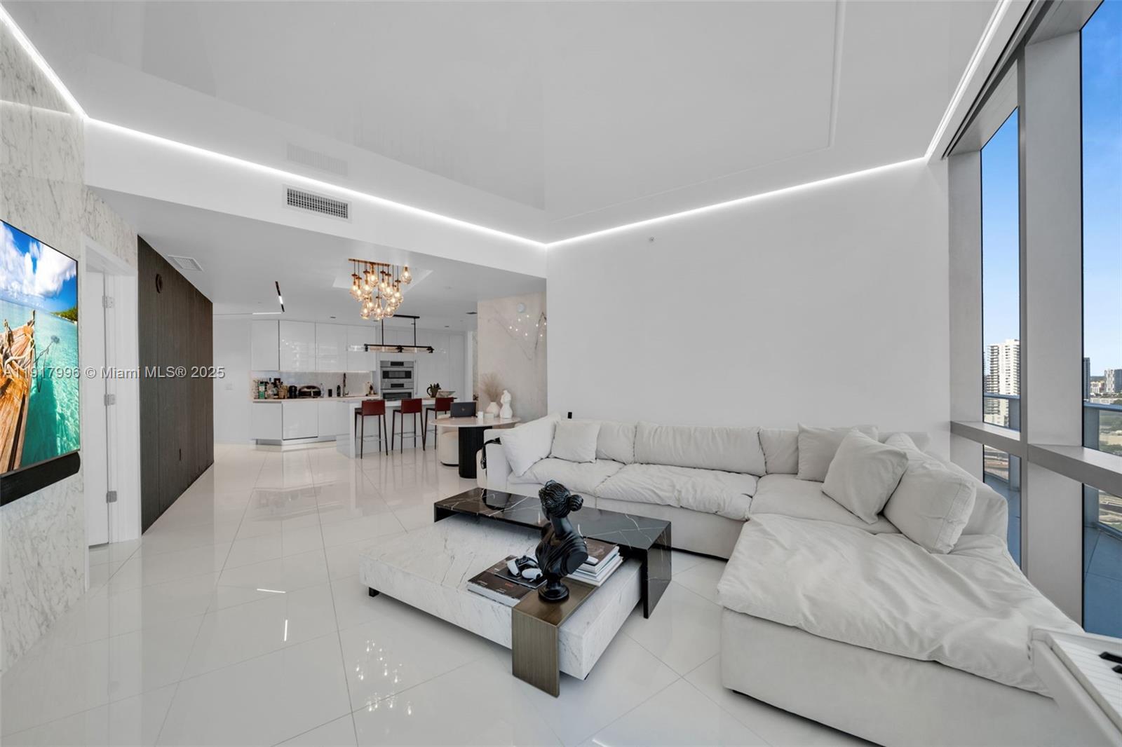 851 Northeast 1st Avenue, Unit 2203 Miami, FL 33132 - Photo 39 of 53 a living room with furniture and white walls