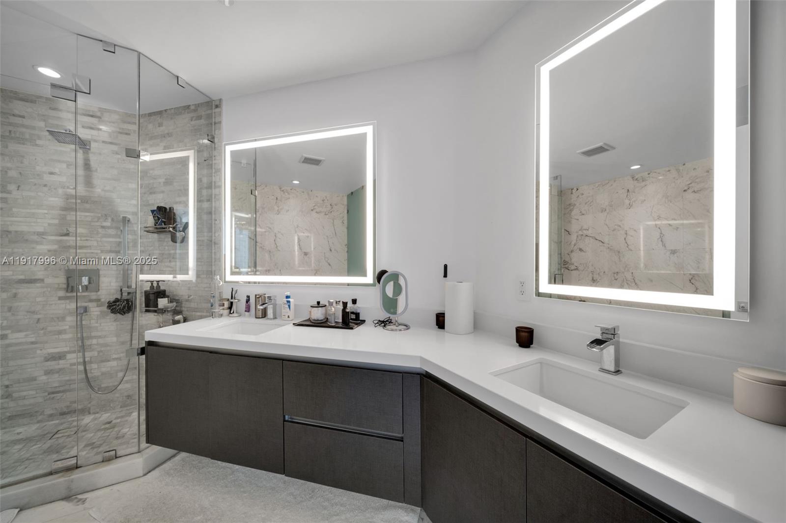 851 Northeast 1st Avenue, Unit 2203 Miami, FL 33132 - Photo 44 of 53 a bathroom with a double vanity sink mirror and double