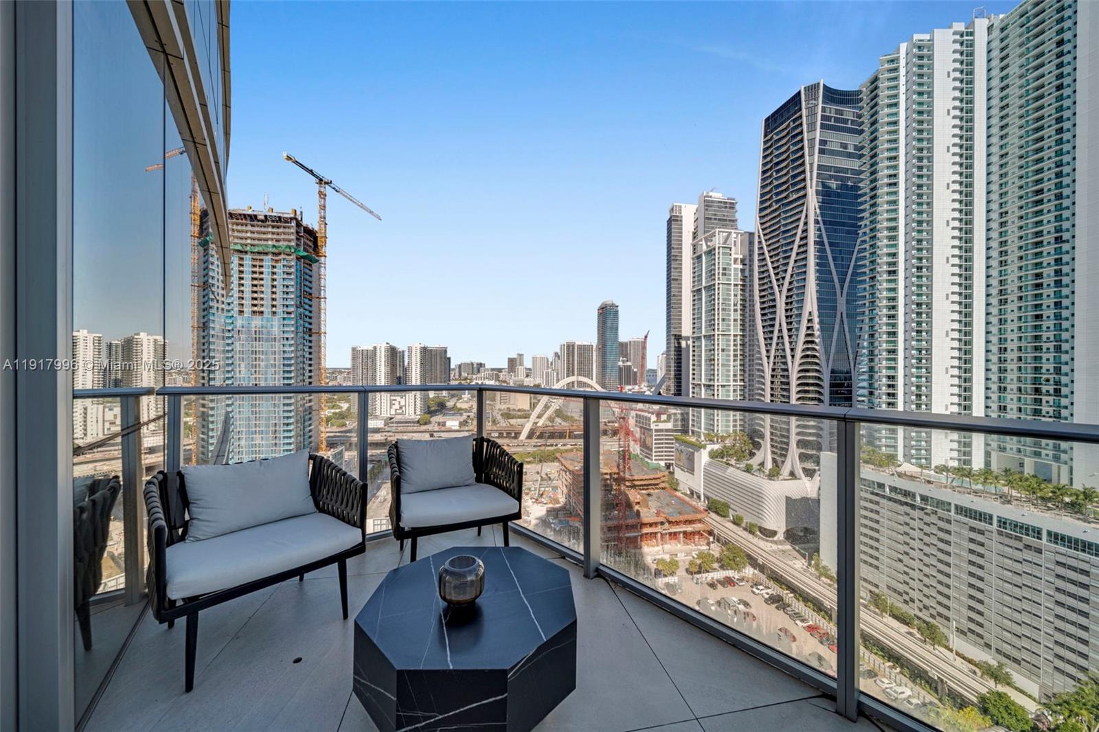 851 Northeast 1st Avenue, Unit 2203 Miami, FL 33132 - Photo 51 of 53 a view of balcony with a couple of chairs