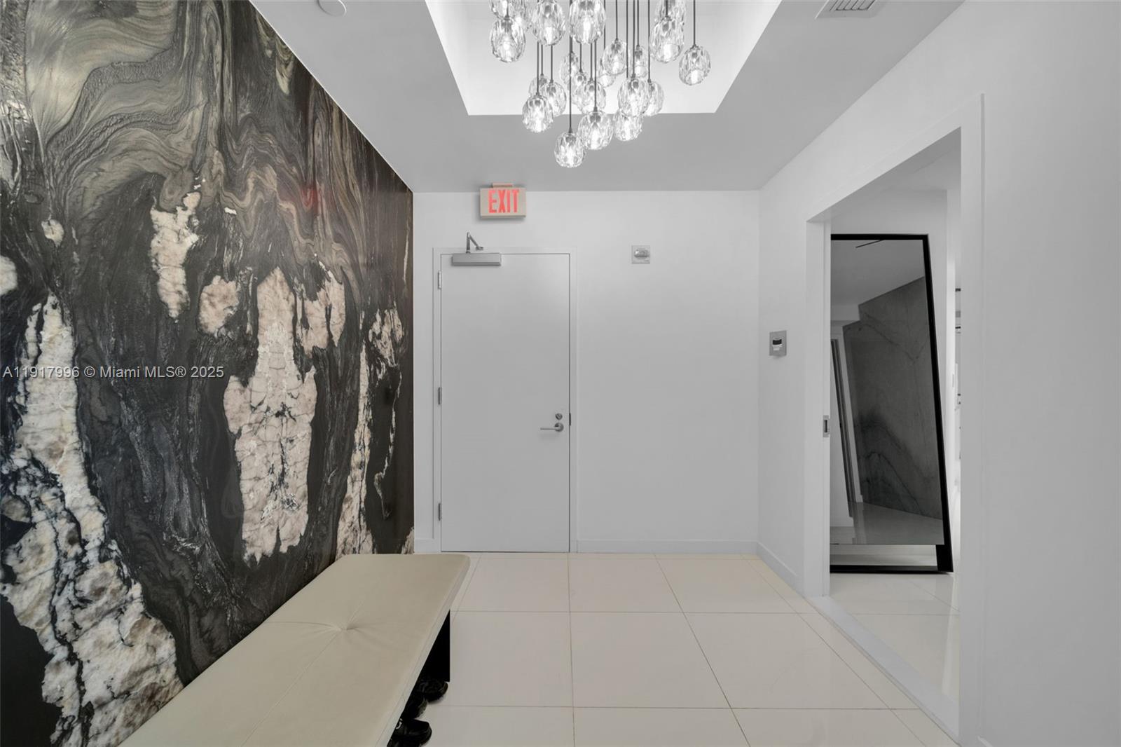 851 Northeast 1st Avenue, Unit 2203 Miami, FL 33132 - Photo 7 of 53 a view of a hallway with windows and chandelier