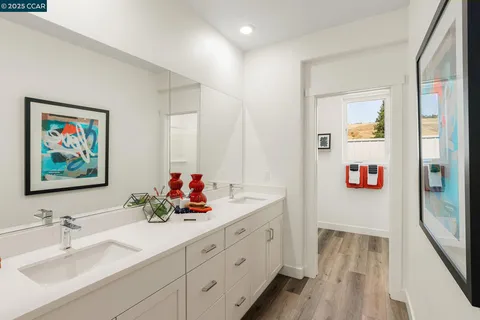 a bathroom with a double vanity sink mirror and double